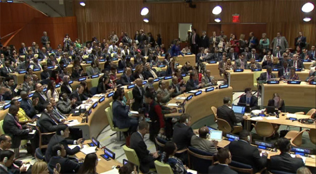 UN delegates applaud as the resolution passes at the General Assembly on 9 September.